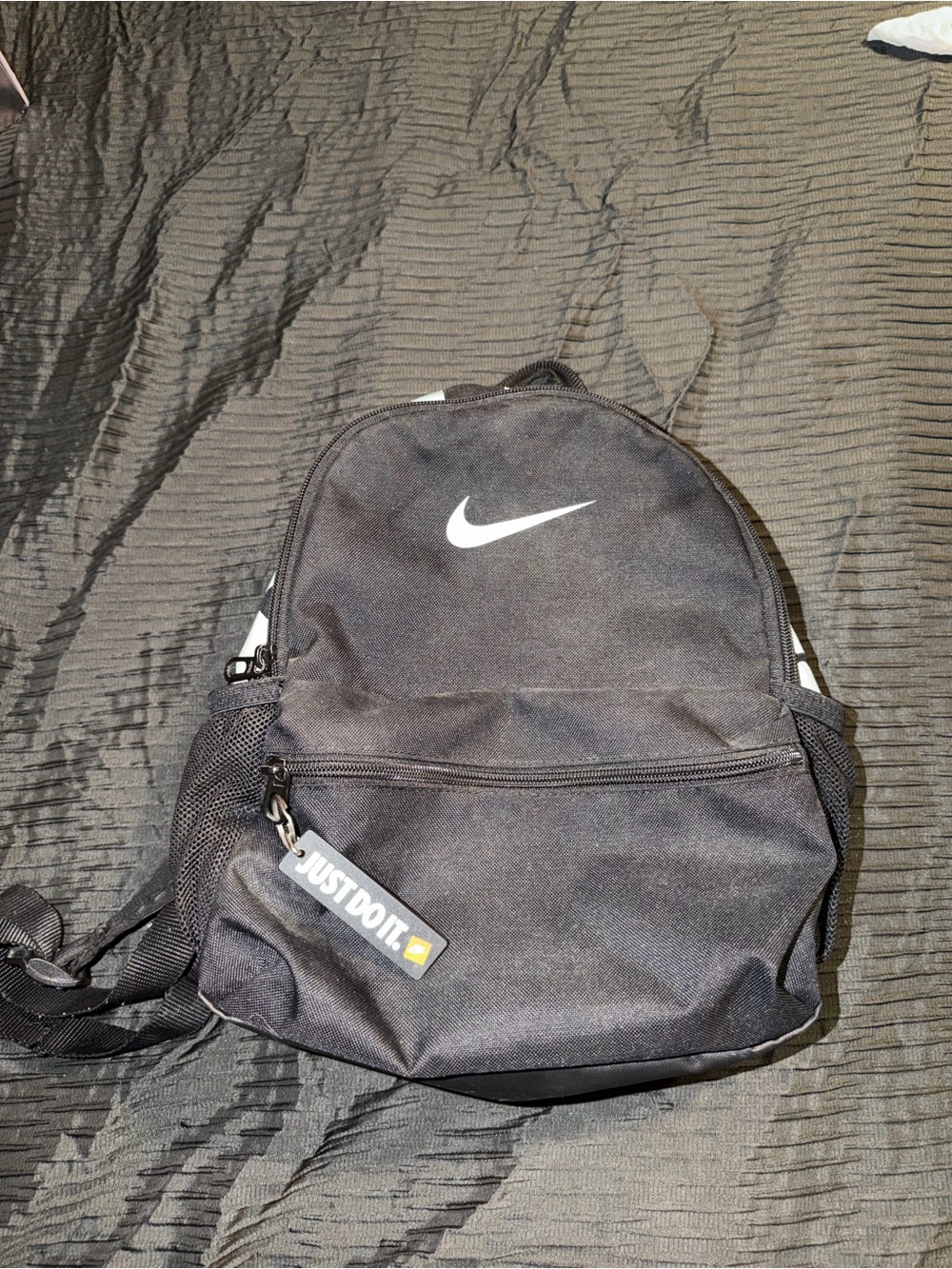 Nike Black Backpack with White Swoosh and 'Just Do It' Tag